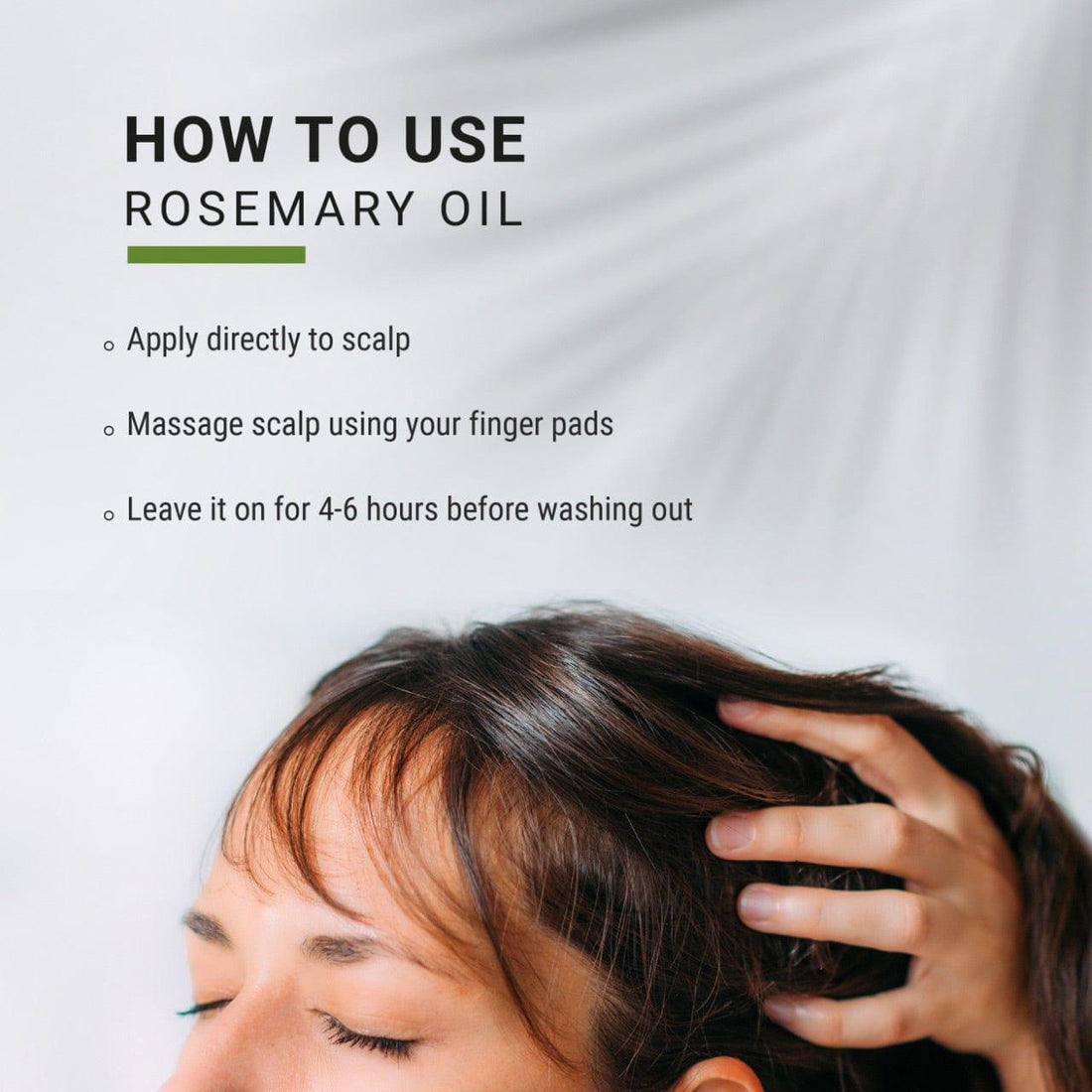 Person applying rosemary oil to their scalp